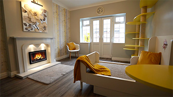 Lemon or yellow colour-themed cat suite showing most of the room, including fireplace, doors and windows, large bed and play wall.