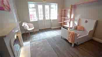 View of the room, facing towards the climbing wall and bed