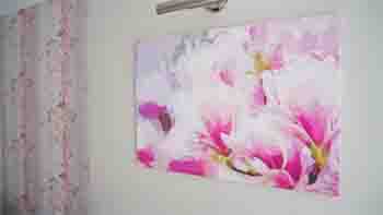 Pink floral art canvas above the fireplace